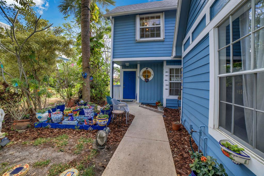 This stunning 3 bedroom, 2.5 bathroom villa is just minutes from the pristine beaches that Jupiter is known for is nestled in a private and quiet community Ocean Dunes. This end unit townhome offers a tranquil retreat surrounded by lush and tropical landscaping. Enjoy the ocean breeze from your front or back patios, or step out onto your back balcony for even more breathtaking views. With man-gated security, you can rest easy knowing that you and your family are safe and secure. Take advantage of the incredible amenities that Ocean Dunes has to offer, including a heated community pool and hot tub, a cabana overlooking the lake, and even tennis and pickleball courts. Whether you're looking for a full-time residence or a vacation home, this townhome is the perfect choice.