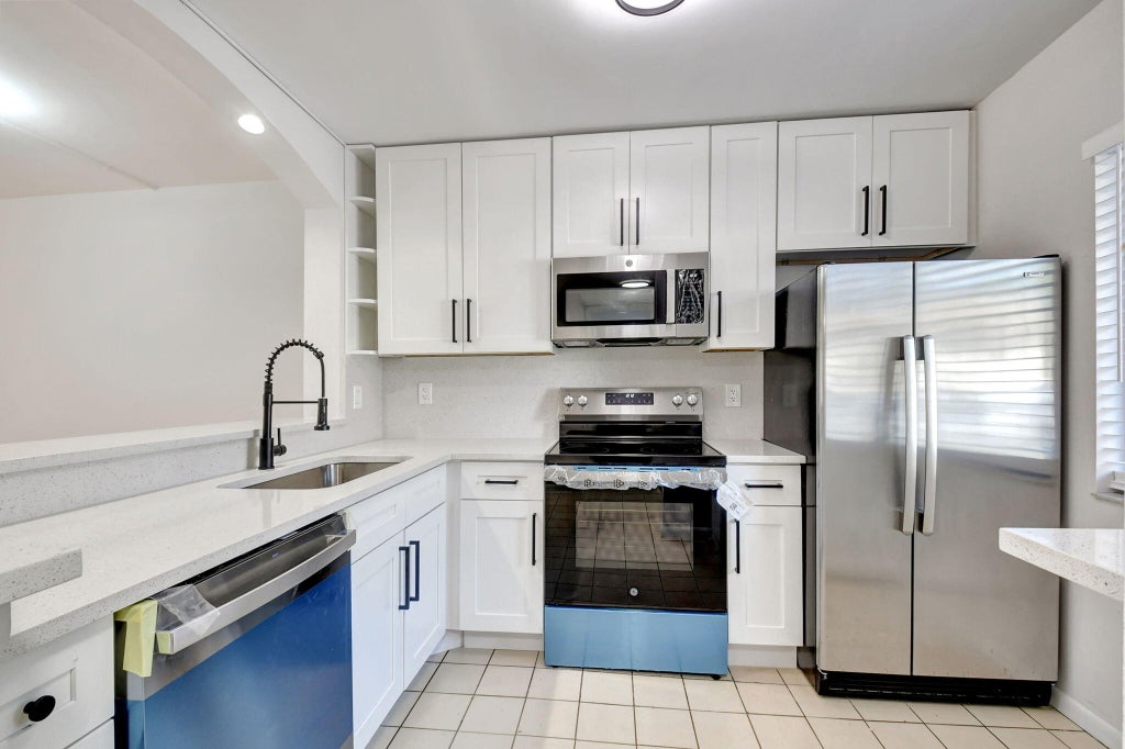 Photo of 6550 Somerset Drive #107, Boca Raton, FL 33433 (MLS # R11041012)