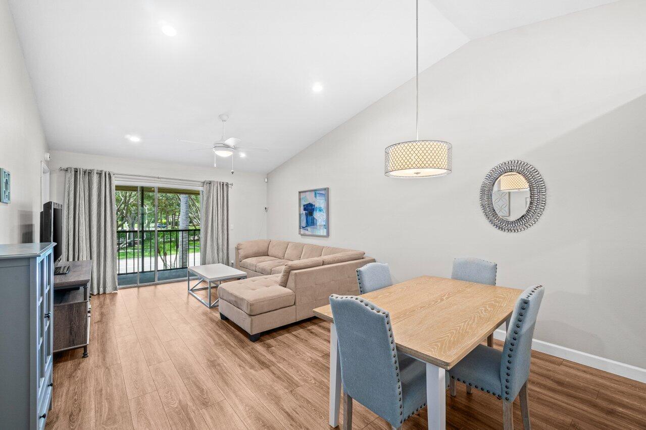 Take a step into this bright and airy 2-bedroom 2 bath condo featuring vaulted ceilings, stainless steel appliances, and a split floor plan. The kitchen is equipped with exceptional amount of countertop space, a pantry, plus a pass through by the kitchen sink providing an open concept to the living area. Primary bedroom has a generous walk-in closet other features to note guest bath has a combo shower tub and welcoming light throughout every bedroom. This home has accordion shutters on windows and sliding glass door for protection. Community pool is steps away from the unit as well as a scenic walking path with mature trees throughout the area.