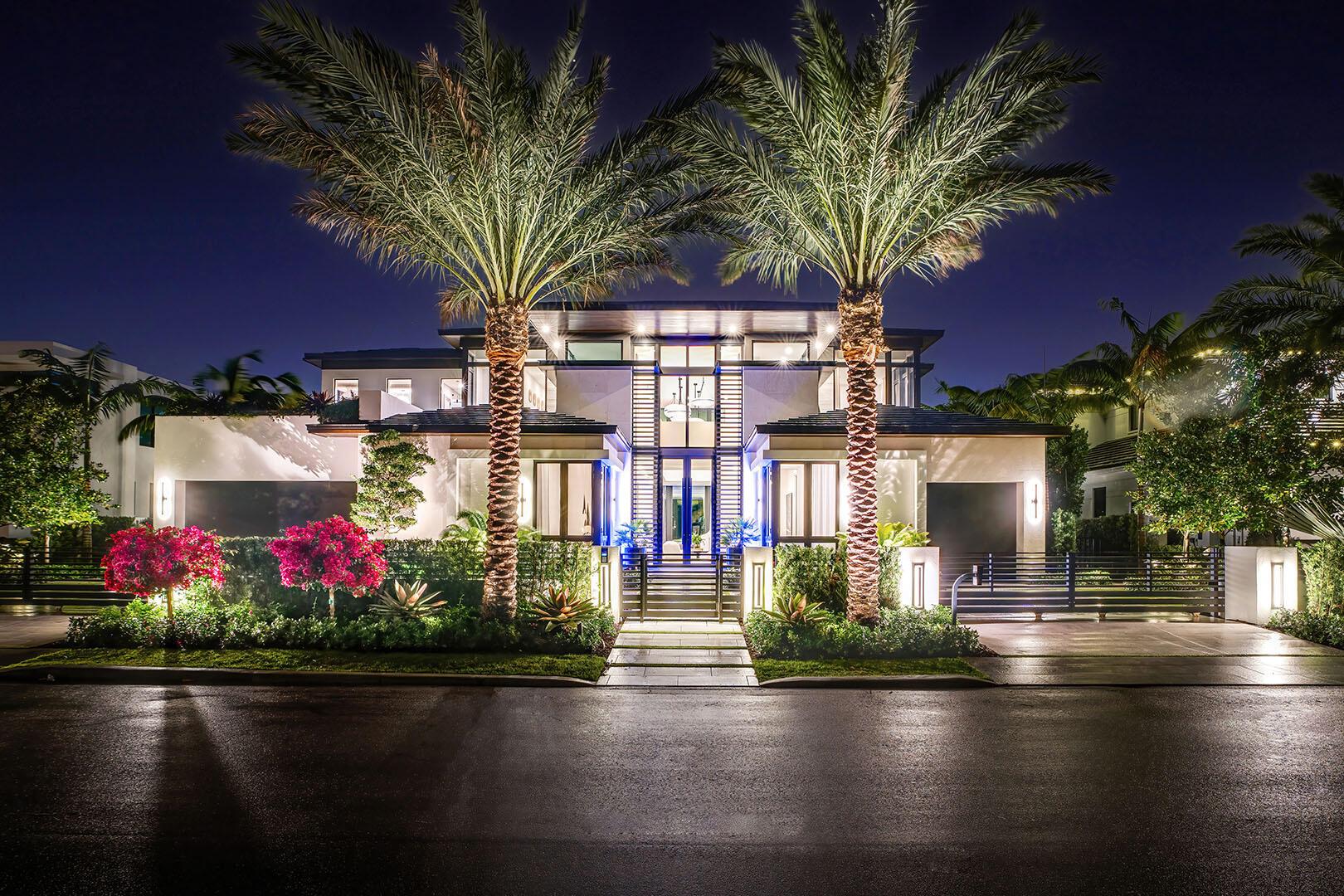 Nestled along 101 feet of the prestigious Butterfly Palm Waterway, this newly completed ultra-luxury contemporary estate developed by Matthew Epstein of Primark Partners sets a new standard that epitomizes waterfront elegance. Architecture by Affiniti Architects with interiors by Michael Gray Interiors, this seven-bedroom residence seamlessly blends innovative design with the finest materials and meticulous craftsmanship, offering a refined lifestyle in one of Boca Raton's most exclusive enclaves. The first-floor primary suite is a serene retreat with indulgent His & Her spa-inspired bathrooms wrapped in Italian travertine and boutique-style closets. The thoughtfully designed interior also includes a chic clubroom with a Quartzite bar, a sophisticated home office, a formal dining