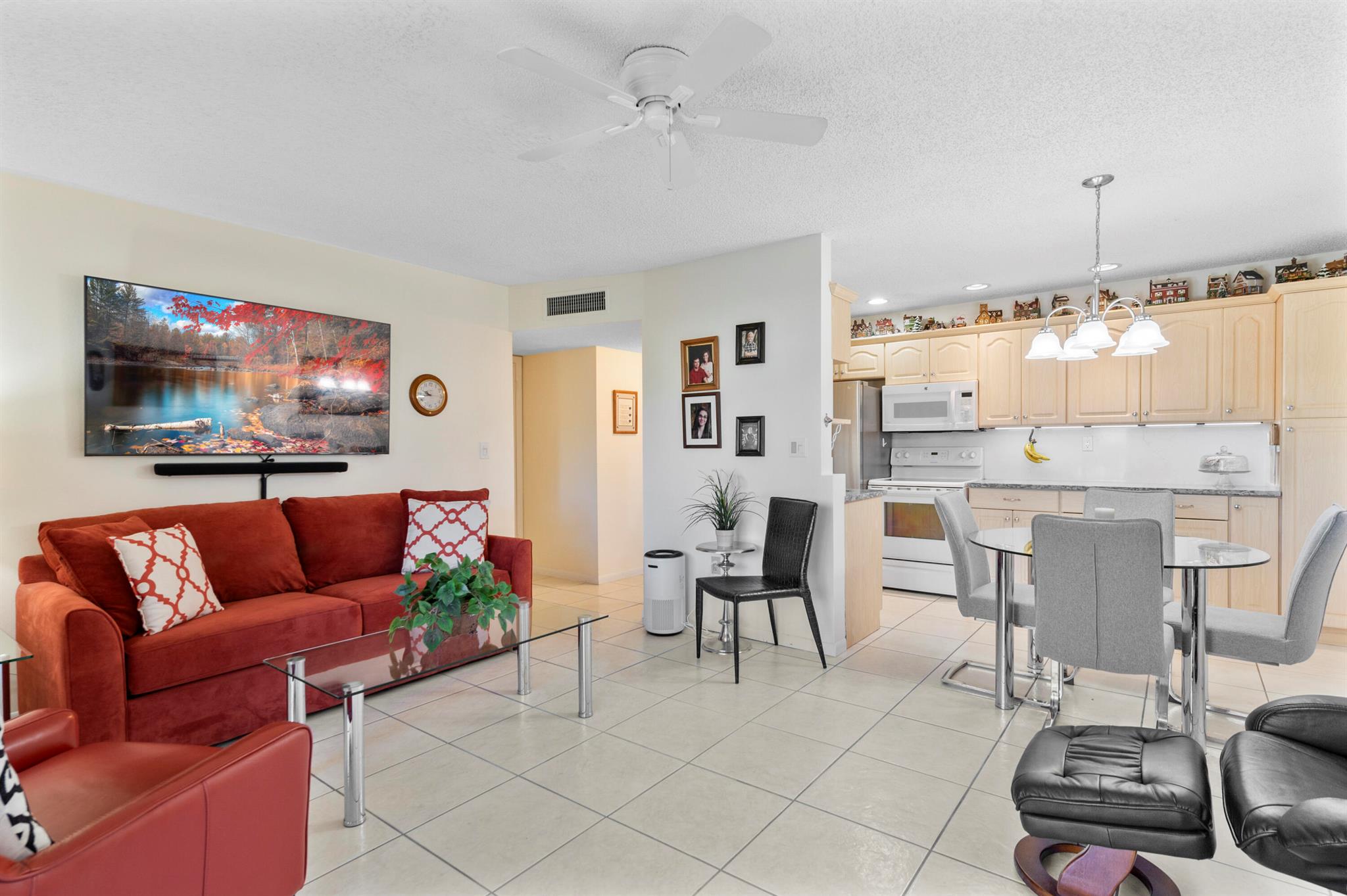 Bright & Airy well-kept 1/1 condo located at Sabal Palm Village in Tamarac, 55+ Community. This immaculate cozy unit is located on the 2nd floor, Large open concept kitchen wooden cabinets w/ additional cabinetry, newer quartz counter tops, under cabinet lighting, SS fridge & white appliances. Tile flooring throughout, A/C 2017, W/Heater 2018, Newer impact hurricane windows. Large M/bedroom w/ custom wall closet (great for extra storing) & walk-in. Enclosed patio features impact windows, electric blinds with remote - Can be used as a Den/Office. Laundry room on premises located on same floor, unit comes w/ extra storage. The association offers a clubhouse with library, fitness room, heated pool, BBQ area & tennis courts etc. Secured Lobby. Mins to Turnpike, Shopping Plazas and Restaurants