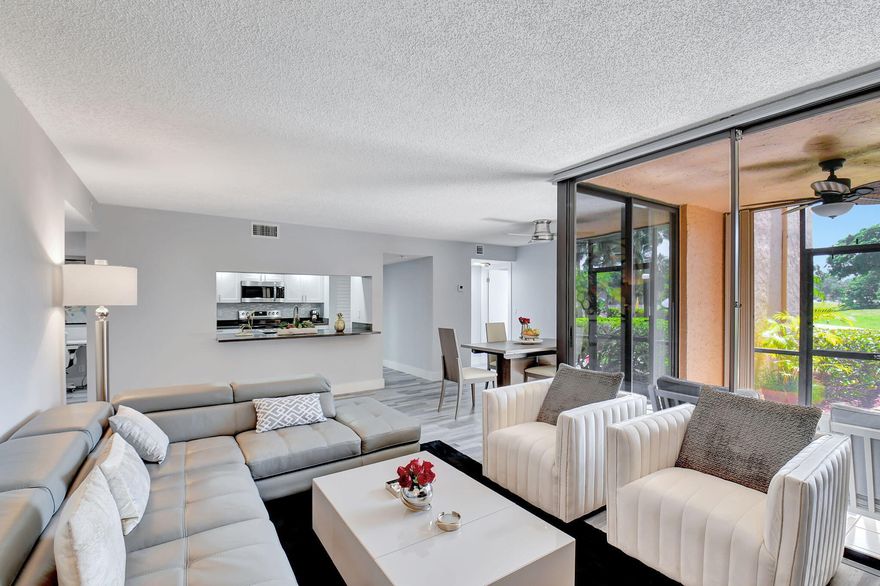 Furnished, designer-inspired 2BR/2BA ground-floor residence in the highly sought-after Delray Racquet Club—investor-friendly and ideal for both seasonal and annual rental income. This turnkey unit showcases an open-concept layout with seamless indoor-outdoor living, featuring direct walk-out access from the screened patio to serene lake views, walking paths, and resort-style pool areas. The ground-floor location enhances convenience while maximizing accessibility and lifestyle appeal. Situated in prime Delray Beach, just 1 mile to the beach and 2 miles to Atlantic Avenue, with walkable access to Whole Foods, Target, Home Depot, and a variety of dining and retail options. Residents enjoy resort-style amenities including a clubhouse, fitness center, tennis courts, and multiple pools.