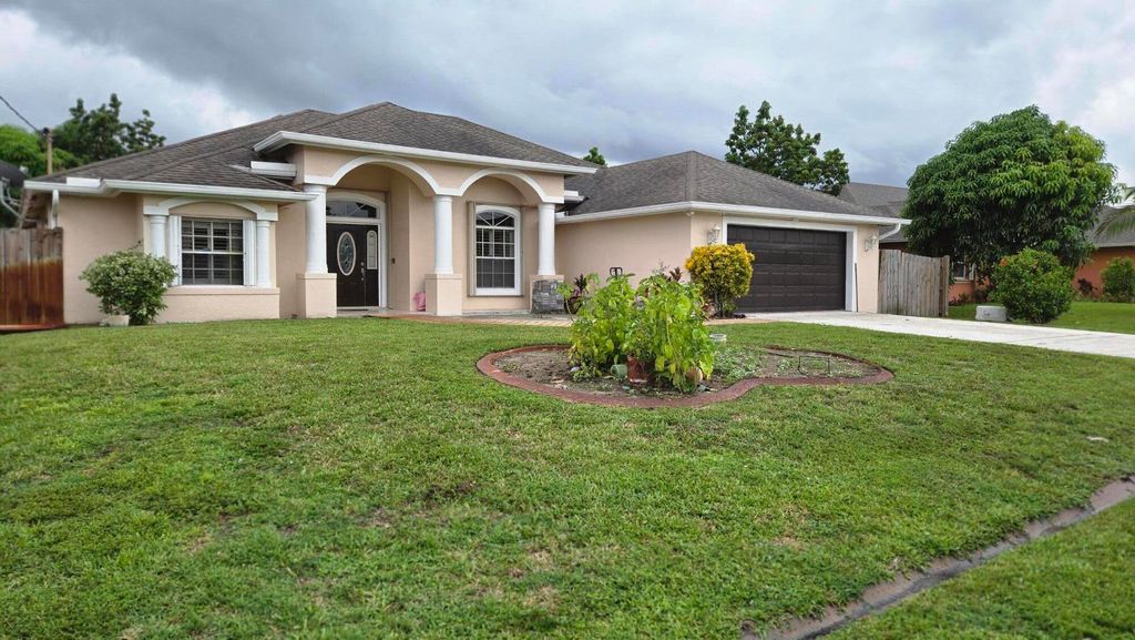 Photo of 534 SW Halifax Avenue, Port Saint Lucie, FL 34953 (MLS # R11123596)