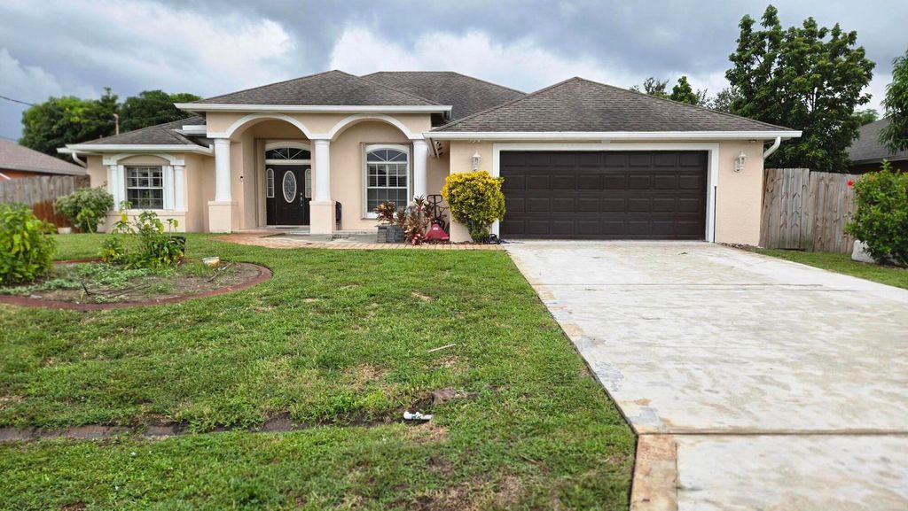 Photo of 534 SW Halifax Avenue, Port Saint Lucie, FL 34953 (MLS # R11123596)
