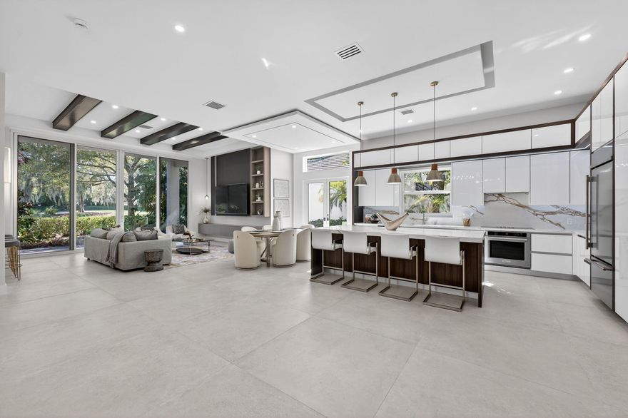 Fabulous, fully redesigned and updated home featuring 3 bedrooms, 3 bathrooms (all ensuite), plus a private office/den. This residence offers complete impact glass windows and doors, a full-house generator, and a quick-recovery hot water heater. Additional upgrades include a new roof with gutters. Enter through double glass doors into a spacious foyer that opens to a large Great Room. The kitchen showcases an oversized center island, abundant storage, brand-new stainless steel appliances, a microwave drawer, and elegant quartzite countertops. The family room features a custom built-in wall unit and 12-foot impact glass sliding doors that lead to an extended patio deck with stunning golf course views.
This home features a partial golf​​‌​​​​‌​‌​​​‌‌​​​‌‌‌​​‌​​‌‌​​​​ membership.