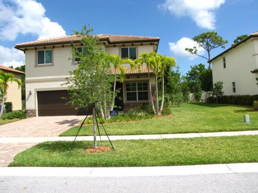 Large, Light and Bright 5 Bedroom, 3 Bath 2 Car Garage home is lovely community!  SS GE appliances, granite, Large bedroom and full bath on 1st floor, Huge Master Suite and very generous size 3 bedrooms plus loft on 2nd floor.  Nice size backyard and covered patio in pet friendly neighborhood.  All impact windows and doors.  No Carpet - New vinyl wood plank flooring upstairs and tile downstairs.  Located in the most sought after Limestone Creek Elementary School District.  This IS the Perfect family home close to shopping, dining and entertainment.  Easy access to I-95 and Turnpike