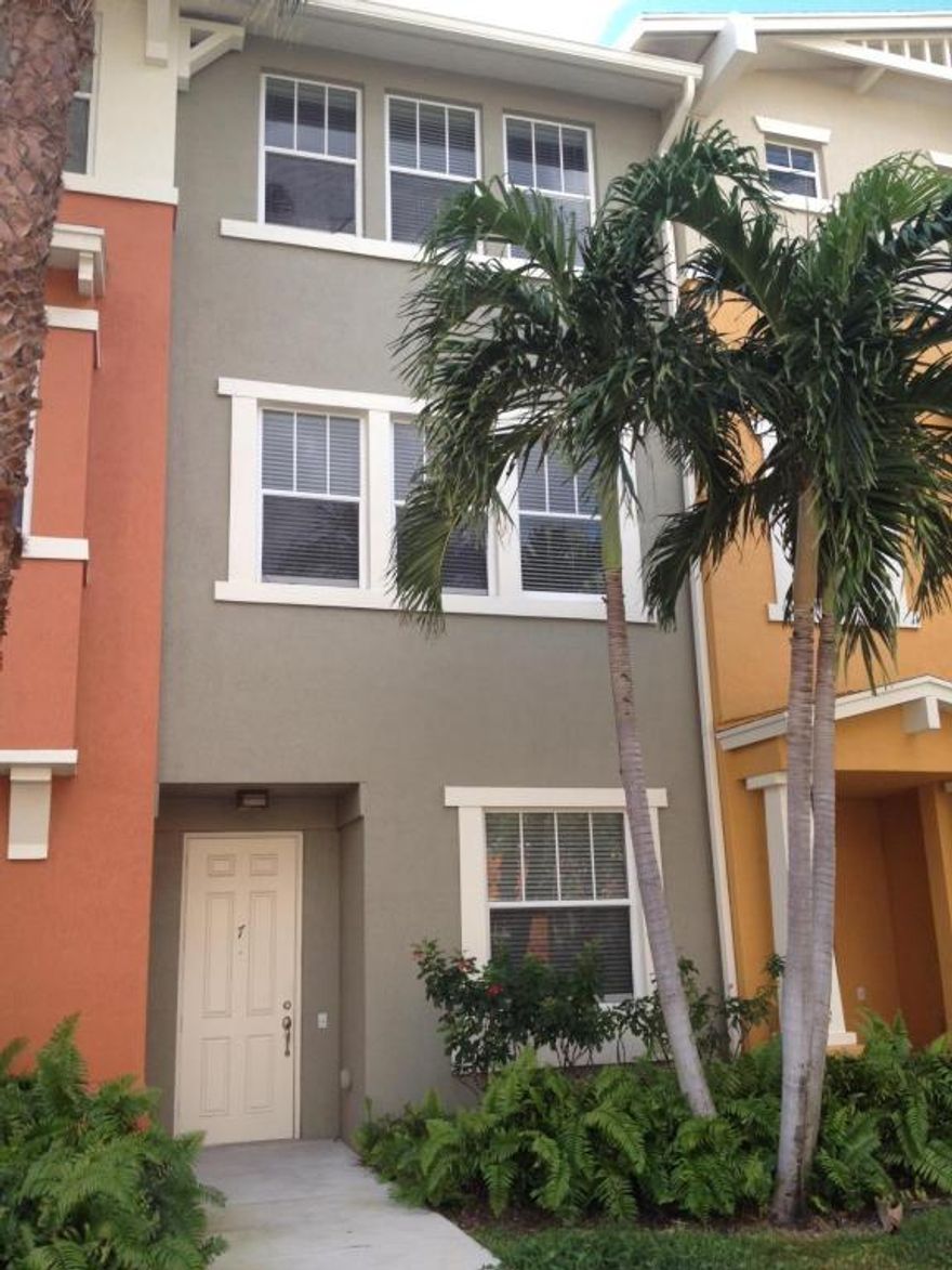 Great location in Cityide.  Interior building near clubhouse and pool. Vacant & move-in ready.  Tiled main living area.  Bonus office / spare room on first floor.  Oversized 1 car garage with additional driveway parking.  5 minutes from I-95, downtown & the airport.  Walk to shopping and dining at the Palm Beach Outlet Shoppes, Whole Foods, Target & Home Depot.  Resort style community in a friendly neighborhood setting.  Amenities include: 24hr manned gated security w/ nightly roving patrols, onsite management & maintenance, state of the art clubhouse and gym facilities, HUGE lakeside pool w/ covered BBQ area, and paved lakeside jogging path.  Rent includes basic HD cable & internet service, trash removal, and water.