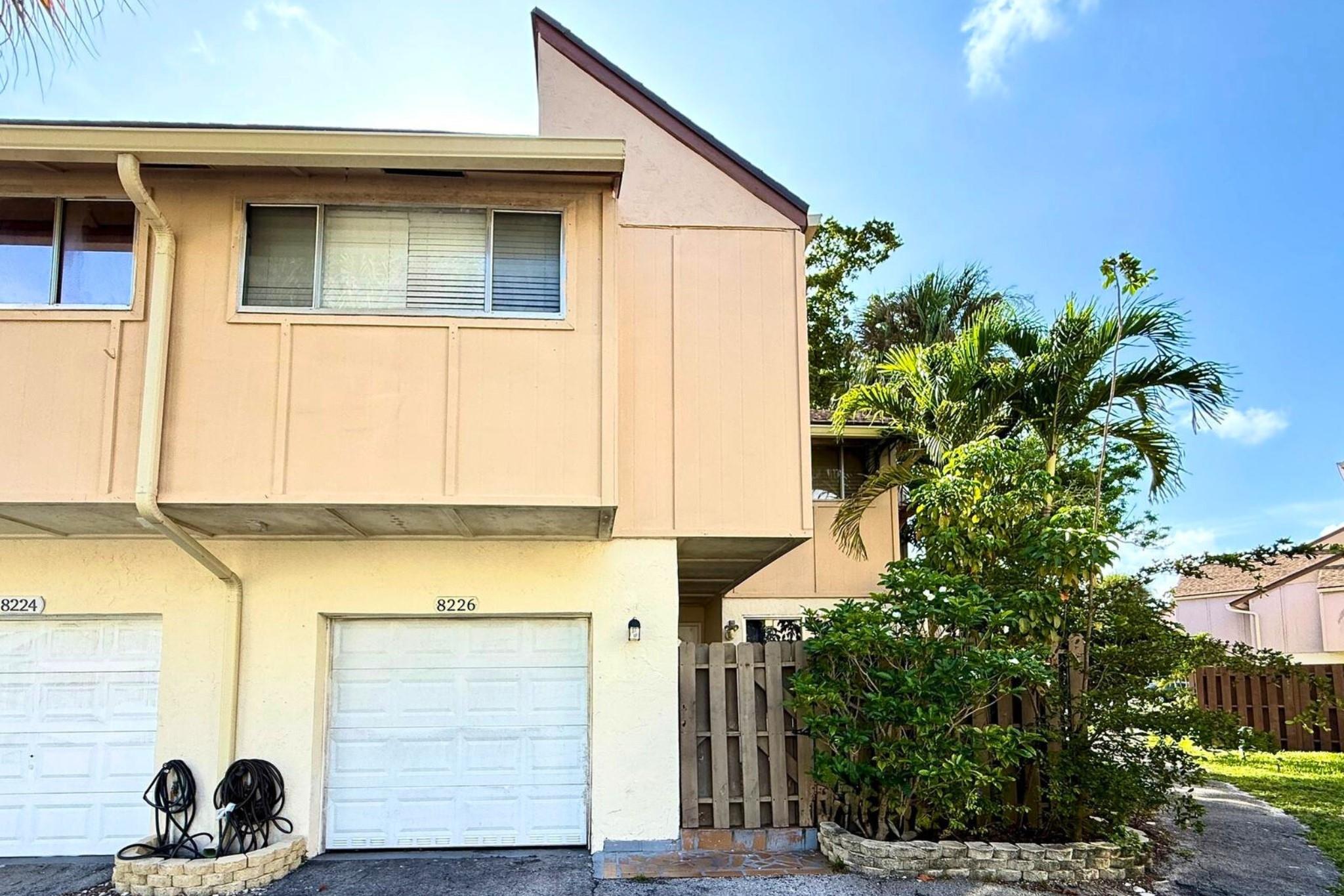 Welcome to this beautiful 4-bedroom, 2.5-bath corner townhouse in the sought-after Townhouses at Jacaranda C community! This two-story attached unit features a spacious layout with bright airy living areas, private gated front entry, and one-car attached garage. Enjoy modern kitchen with ample cabinet space, a separate dining area, and a living room perfect for entertaining. Upstairs, you'll find all bedrooms including a generously sized primary suite with ensuite bath. Additional highlights include tile plank flooring throughout the second floor, in-unit laundry, and accordion shutters for peace of mind. Residents enjoy access to community amenities including two pools, tennis courts, and a playground. Centrally located near top-rated schools, parks, shopping, dining, and major highways.