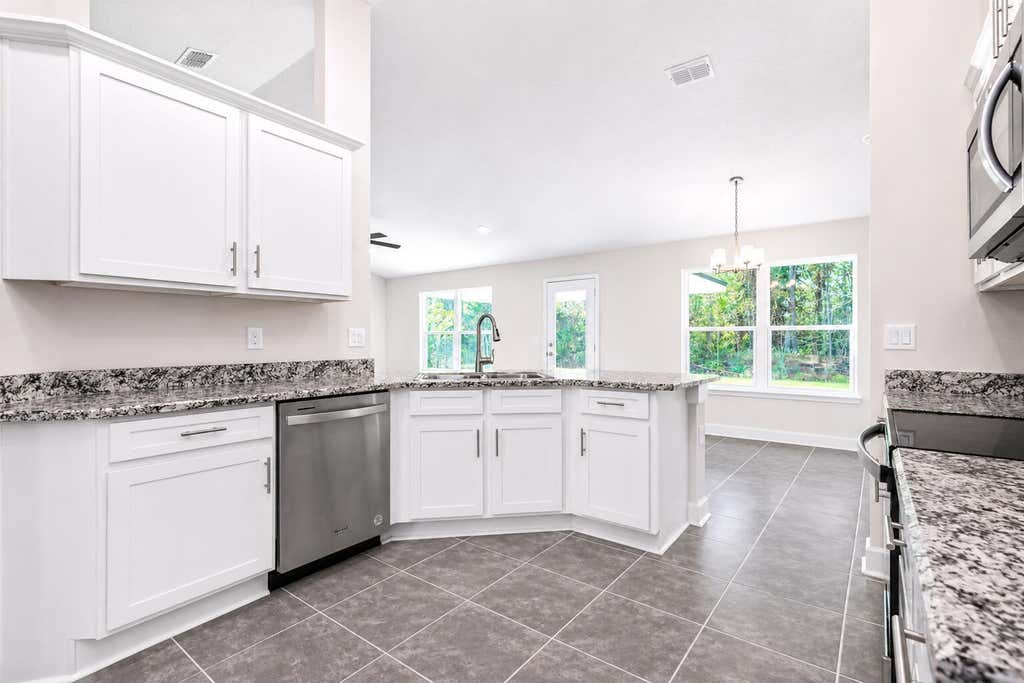 Photo of 405 NE Airoso Boulevard, Port Saint Lucie, FL 34983 (MLS # B26052229)