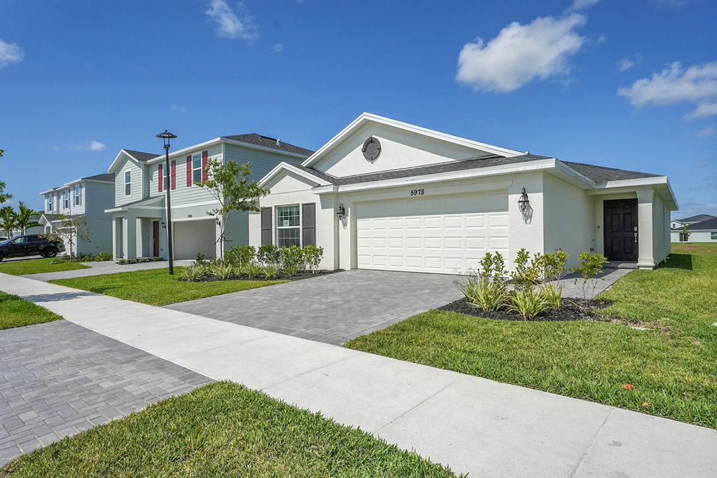 Photo of 5978 NW Pickering Drive, Port Saint Lucie, FL 34987 (MLS # R11085564)