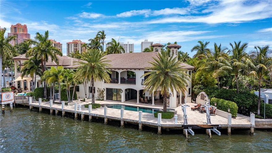 Custom built in 2014 with no detail spared, this impressive five-bedroom estate, with 7,769 total square feet, offers a thoughtful layout that accommodates water views and allows for entertaining to evolve effortlessly, flowing from room to room with ease. Its elegant Mediterranean exterior features a tower, bays, and shuttered windows in the grand entrance, while in the back of the estate, banks of sliding doors open to the direct intracoastal water-view pool and patio. A luxe trophy estate, with 150 +/-  feet of direct Intracoastal Waterway frontage offering wide water views in sought-after Dolphin Isles, a Fort Lauderdale Beach enclave, within two-blocks to the sand. Amenities include a wine room, bar, volume ceilings and a great floor plan affording an easy flow for entertaining. Disclaimer: Information published or otherwise provided by the listing company and its representatives including but not limited to prices, measurements, square footages, lot sizes, calculations, statistics, and videos are deemed reliable but are not guaranteed and are subject to errors, omissions or changes without notice. All such information should be independently verified by any prospective purchaser or seller. Parties should perform their own due diligence to verify such information prior to a sale or listing. Listing company expressly disclaims any warranty or representation regarding such information. Prices published are either list price, sold price, and/or last asking price. The listing company participates in the Multiple Listing Service and IDX. The properties published as listed and sold are not necessarily exclusive to listing company and may be listed or have sold with other members of the Multiple Listing Service. Transactions where listing company represented both buyers and sellers are calculated as two sales. The listing company’s marketplace is all of the following: Vero Beach, Town of Orchid, Indian River Shores, Town of Palm Beach, West Palm Beach, Manalapan Beach, Point Manalapan, Hypoluxo Island, Ocean Ridge, Gulf Stream, Delray Beach, Highland Beach, Boca Raton, East Deerfield Beach, Hillsboro Beach, Hillsboro Shores, East Pompano Beach, Lighthouse Point, Sea Ranch Lakes and Fort Lauderdale. Cooperating brokers are advised that in the event of a Buyer default, no commission will be paid to a cooperating Broker on the Deposits retained by the Seller. No commissions are paid to any cooperating broker until title passes or upon actual commencement of a lease. Some affiliations may not be applicable to certain geographic areas. If your property is currently listed with another broker, please disregard any solicitation for services. Copyright 2021 listing company All Rights Reserved.Upon entering the foyer and stair hall, with a circular stairway ornamented with wood treads, hand-painted tile risers, and wrought-iron railing, the elegant great room is revealed through an arched opening flanked by classical columns. Offering Intracoastal views, highlights in the great room include a beamed and coffered ceiling that soars two-stories, a focal-point fireplace faced in authentic stacker field stone, a wet bar with a built-in ice maker and a lighted onyx countertop, and a temperature-controlled wine room. Just off the great room are the office, dining room, family room and kitchen, all also offering water views. The island kitchen is fitted with custom cabinetry, granite countertops, stone backsplashes, walk-in pantry and stainless Thermador appliances. Double glass sliders from the oversized great room, topped with a tray ceiling, lead out to the pool and outdoor entertainment area.  Also on the first floor are a guest suite/media room, powder room and laundry. Upstairs, from the open gallery overlooking the great room, the serene master suite presides over the southwest portion of the layout comprising a private water-view balcony with wet bar and TV, a large walk-in closet and spa-like bathroom with a large walk-in shower, separate water closet, and soaking tub. Also on the second floor are three ensuite guest bedrooms and a loft with a wet bar that accesses a balcony. Built for easy maintenance, details include a mechanism to lower the chandelier for cleaning, and water heaters and air-conditioning handlers in the walk-in attic, which is built out for storage and servicing. For luxurious care-free living, other amenities include handsome tile and wood flooring, hurricane impact glass exterior doors and windows, a Whole-Home generator, electric shades throughout, mosquito misters, Whole-Home surround sound, security and camera system and solid core doors. Completing the layout is an attached two and a half-car garage with epoxy floors.Additional features include: • Custom Built Cabinets Throughout• Full Residential Fire Sprinkler System• Full Cabana Bath and Outdoor Shower• Additional 2nd Floor Laundry Room• Epoxy Garage flooring – 2.5 car garage• 1000 Gallon Underground Propane Tank• Interior Wall Sound Proofing• Icynene Spray Foam Throughout Attic
