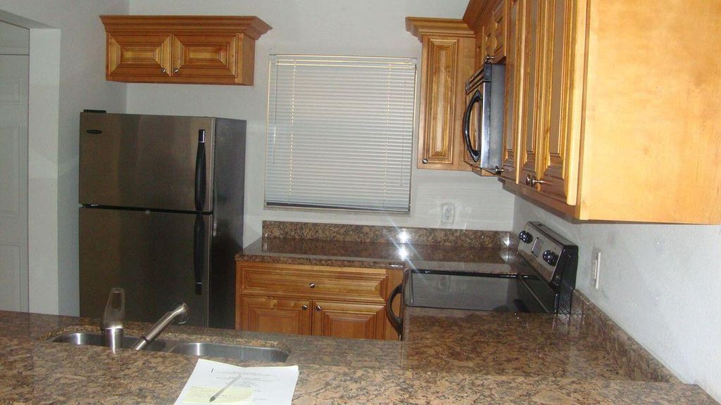 Photo of 1515 Lake Crystal Drive #H, West Palm Beach, FL 33411 (MLS # B26001386)