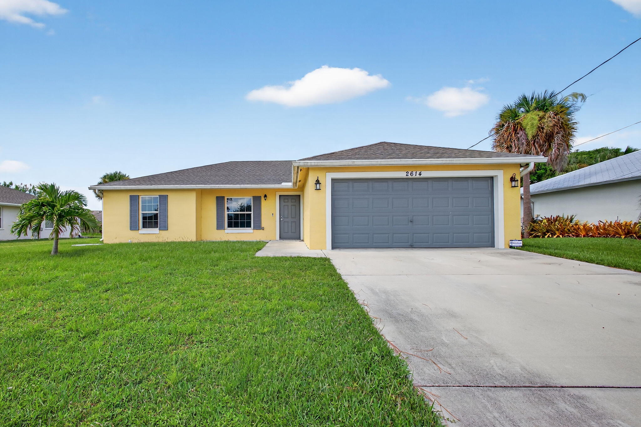 No HOA and built in 2019, this immaculate 3-bed, 2-bath home in Port Saint Lucie has been meticulously maintained. Designed with an open layout, it features recessed lighting, tile throughout, and a spacious living area. The modern kitchen shines with granite countertops, stainless steel appliances, and a large island perfect for gatherings. The oversized master suite offers a walk-in closet and upgraded shower. Hurricane impact windows and doors provide peace of mind. Complete with a 2-car garage and large backyard, just minutes from Tradition's shopping, dining, and entertainment. Schedule your tour today!