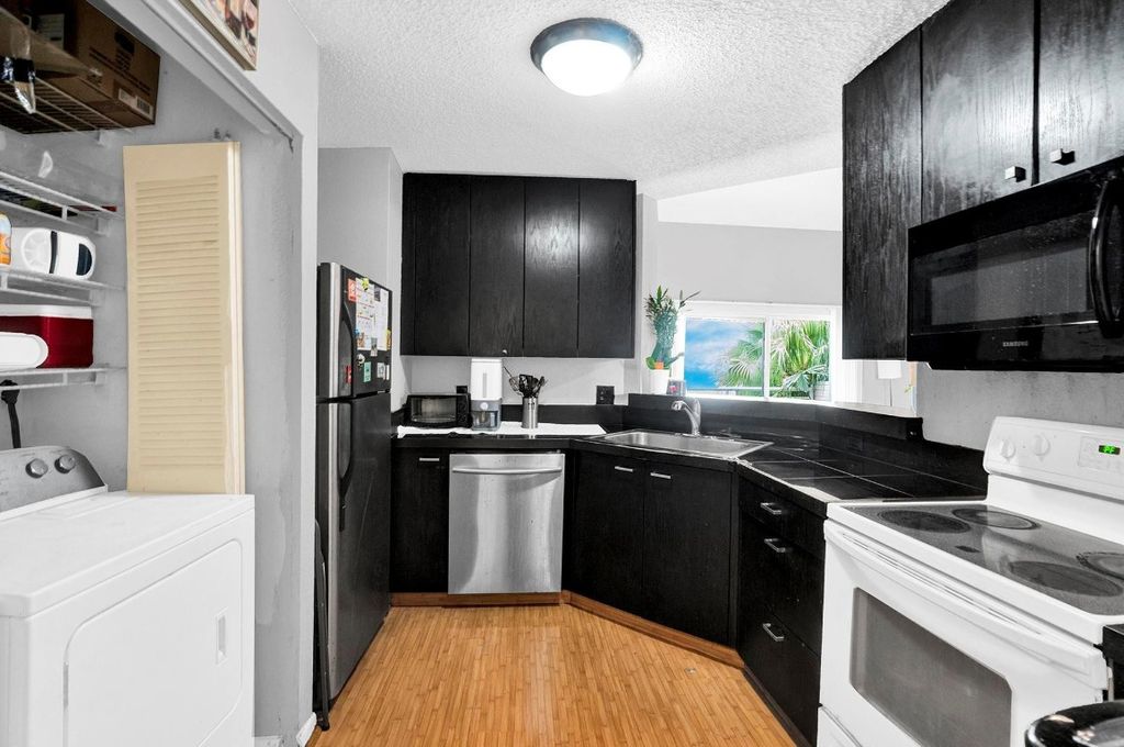 Photo of 3413 NW 44th Street #205, Lauderdale Lakes, FL 33309 (MLS # F10534019)