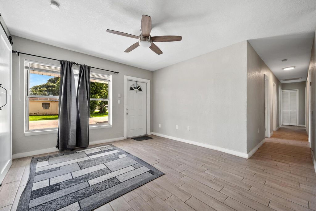 Photo of 1233 Vaughn Circle, Belle Glade, FL 33430 (MLS # R11022355)