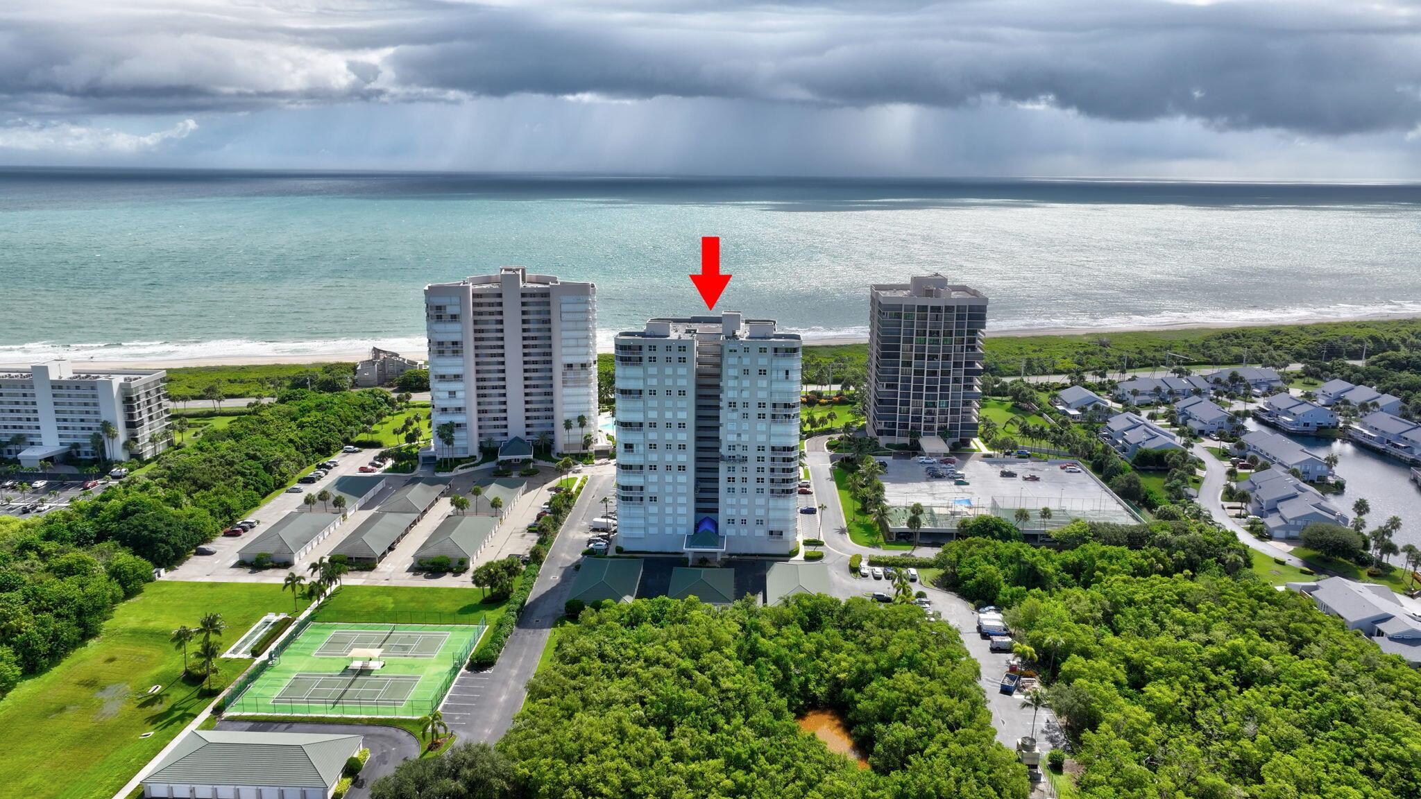 Endless Views. Timeless Style. Coastal Perfection. Indulge in luxury oceanfront living from this spectacular 14th-floor end unit boasting unobstructed, panoramic views of the Atlantic. Wake to breathtaking sunrises and savor the serenity of coastal breezes from your expansive wrap-around balcony. This beautifully appointed 3BR/2BA residence showcases an updated kitchen with new stainless-steel appliances, elegant baths, and accordion shutters for peace of mind. Every bedroom captures a view of the sea, creating a seamless connection to the shoreline. Seabreeze is a private, gated community offering resort-style amenities including a sparkling pool, fitness center, clubhouse, billiards, and tennis. Enjoy deeded beach access, a fishing dock, and kayak launch for endless seaside adventure.