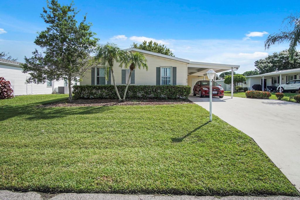 Photo of 3004 Five Iron Dr, Port Saint Lucie, FL 34952 (MLS # R11004991)