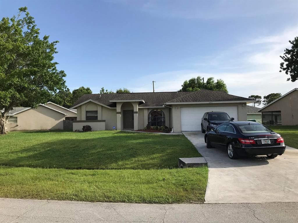 Photo of 6911 NW Hershy Circle, Port Saint Lucie, FL 34983 (MLS # R10703495)