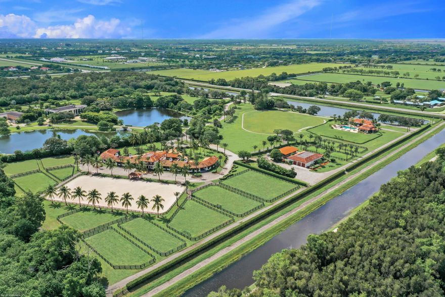 Remarkable equestrian estate just shy of 20 acres in the most prime location for showing at WEF! Ride directly out of your back gate, a straight shot down the bridle path in just a 9 minute walk to the PBIEC showgrounds. This property is fully gated and has a 20 stall barn with great amenities including beautiful lounge with separate office, living area and kitchen with dining area, a 2015 home with 3 beds/3.1 baths plus a one car garage, a fantastic pool house with 1 bed/1 bath and attached gym, a separate maintenance building and more than enough green space to build your dream home. SEE MORE...