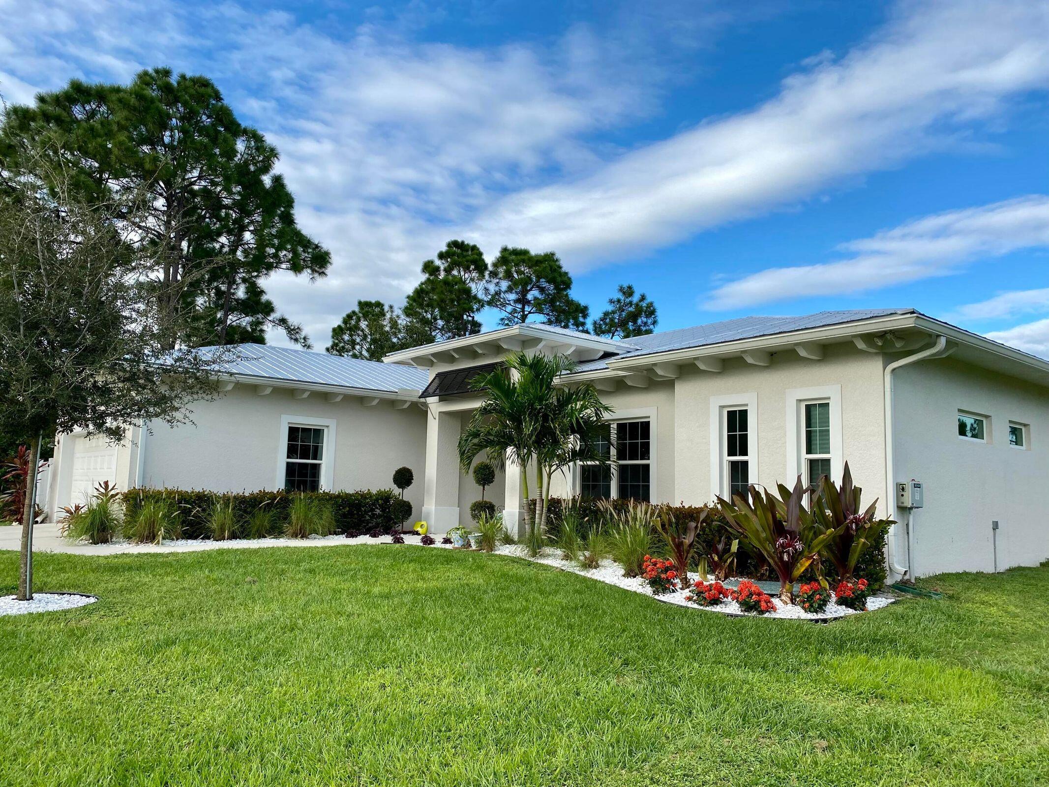 Stunning 3-bedroom 2.5 bath w/ den that could be converted to a 4th bedroom. Built in 2020 with many upgrades. Double door entry that overlooks the open concept living room. This home was built to Hurricane code standards, IMPACT windows, sliders, Metal Roof. Fenced in back yard, above ground pool, Lush Landscaping. This home will not disappoint. A must see.Conveniently located off Becker Road, just minutes from Turnpike or I-95 in Port Saint Lucie.