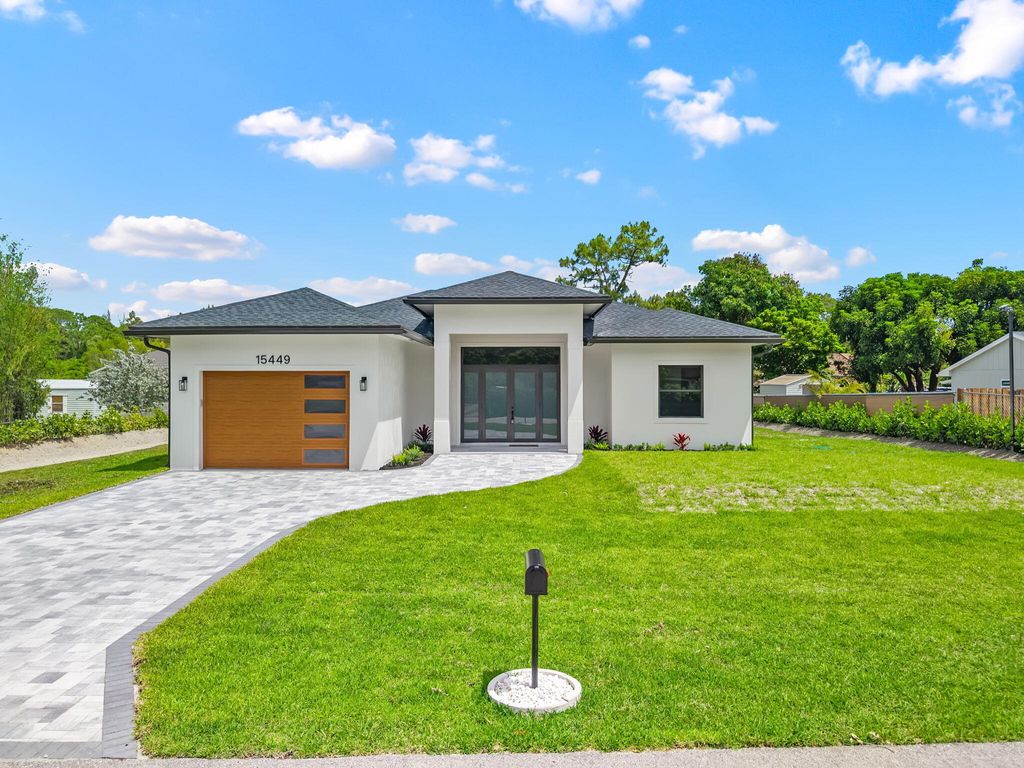 Photo of 15449 Los Angeles Drive, Loxahatchee Groves, FL 33470 (MLS # B26019291)