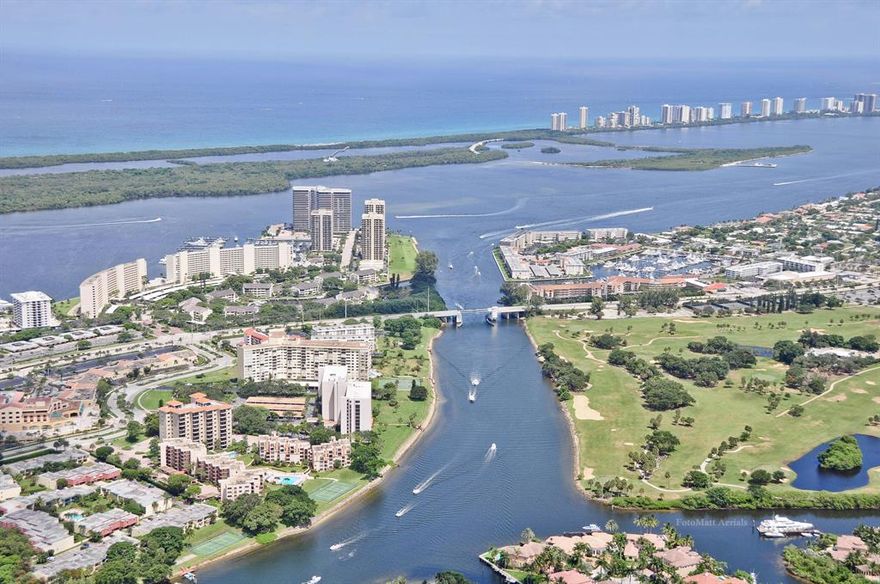 A North Palm Beach  (3Br or 2 with den) '' villa' lifestyle viewing the Intracoastal with the turn key  conveniences of no lawn, roof or exterior maintenance work together with no elevator riding or stairs; and four sides of natural sunlight (from 21 windows) in your spacious (2100+sf living area) single story home: A short exclusive walkway tucked inconspicuously off of the brick paved cul de sac leads (12 steps)  from your covered car space to your front door and your private corner ''house '' with peaceful views of the pool, tennis and intracoastal from your private patio garden and master bedroom. (FYI: #207 is on the high ground floor.)