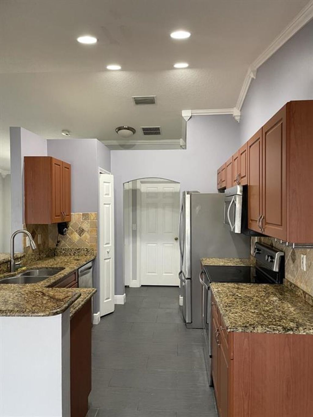 Photo of 5672 NW Wesley Road, Port Saint Lucie, FL 34953 (MLS # R10786018)