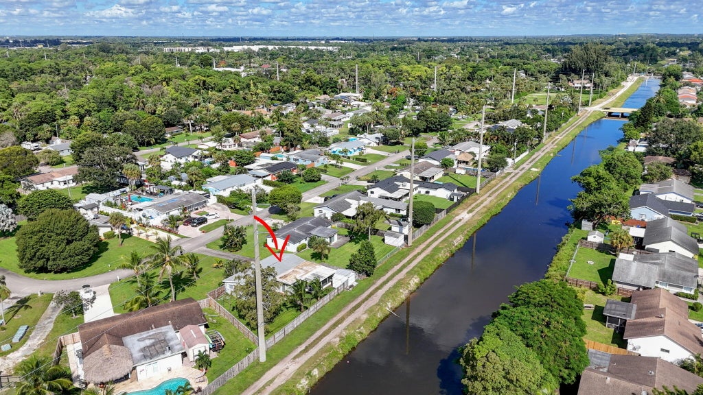 Photo of 446 E SHADYSIDE Circle, West Palm Beach, FL 33415 (MLS # B26088922)