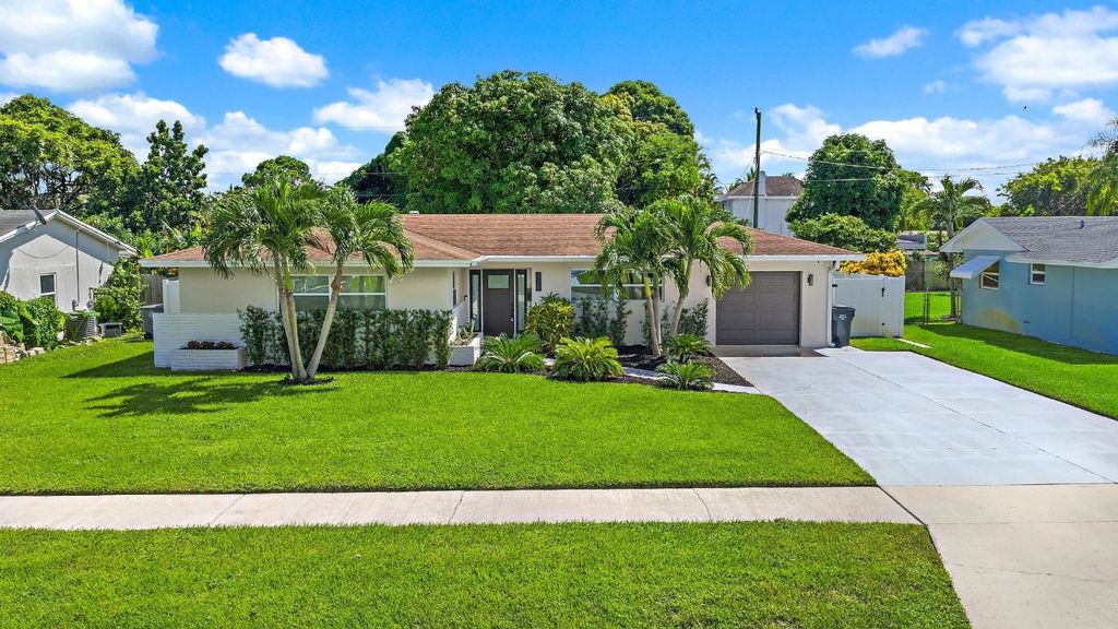 Photo of 428 Hawthorne Drive, Lake Park, FL 33403 (MLS # R11124682)