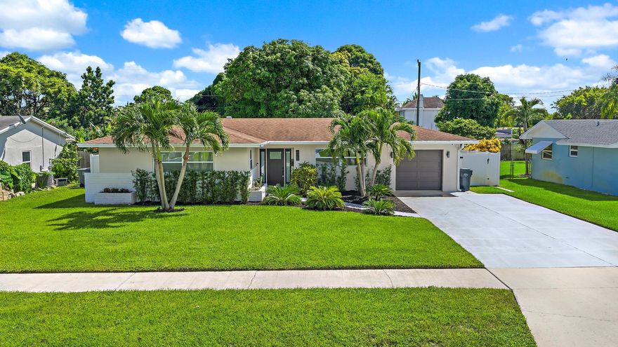 Stylishly updated and move-in ready! This 3BR/2BA home features new porcelain tile flooring (2024), recessed and track lighting, and custom built-out closets. Stay comfortable year-round with central A/C plus a split unit for added efficiency. Recent upgrades include updated plumbing (2023), a tankless water heater, and an A/C system (2020). For peace of mind, the home is equipped with full impact windows, impact doors, and an impact garage door.Step outside to a newly landscaped backyard with fresh fencing, new gutters (2023), and a convenient storage shed.Perfectly located, this home offers quick access to beaches, marinas, and waterfront dining, along with shopping at The Gardens Mall and other major retailers.