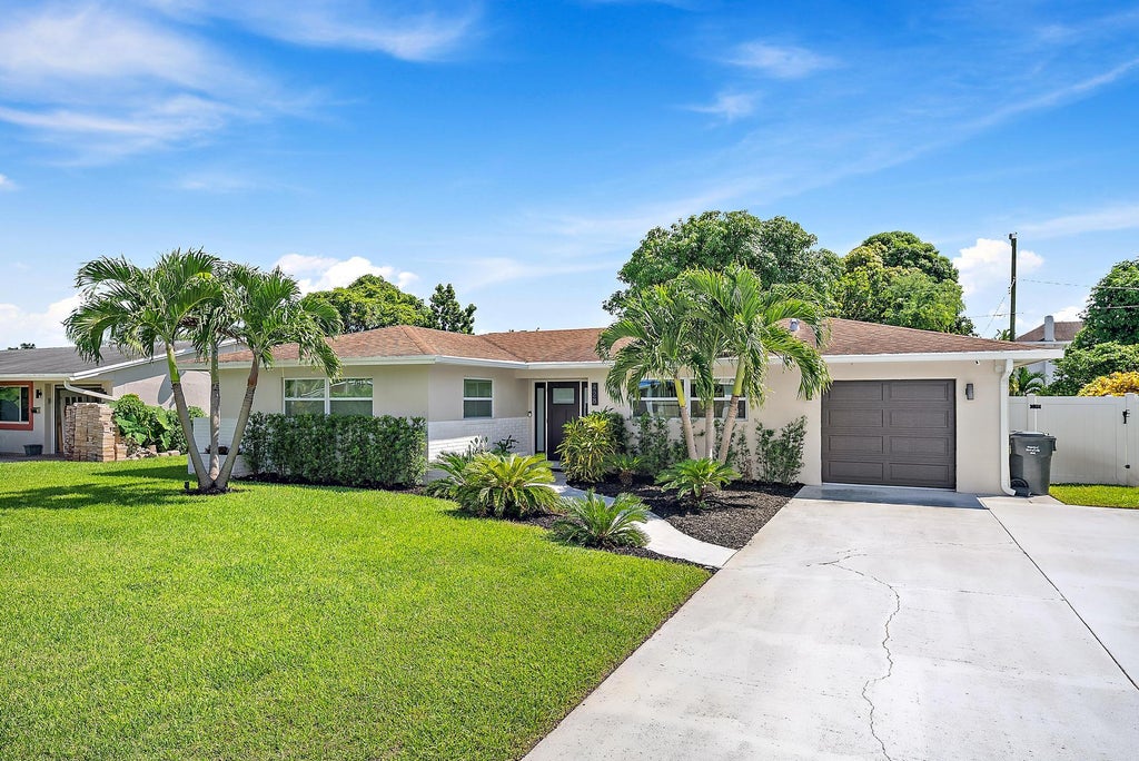 Photo of 428 Hawthorne Drive, Lake Park, FL 33403 (MLS # R11124682)