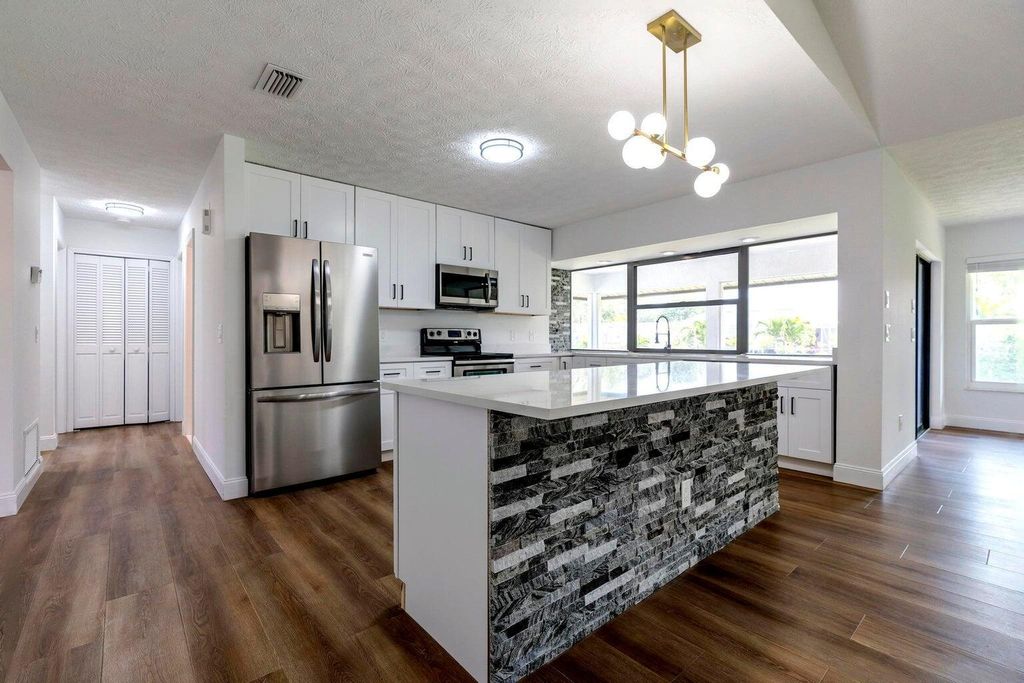 Photo of 2381 SE Aneci Street, Port Saint Lucie, FL 34984 (MLS # R11102905)