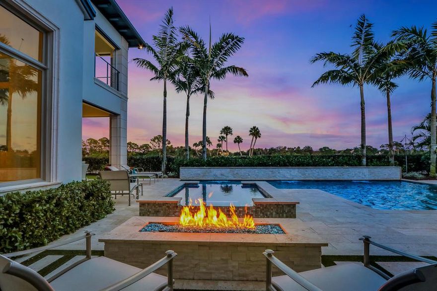 GORGEOUS CUSTOM HOME! This 4 Bedroom, 7 bath home sits on one of the best homesites in the community...at the end of the cul-de-sac with Stunning views of the 9th Fairway leading to the Elegant Clubhouse. This home has it all...Living Room with Aquarium, Beautiful Gourmet Chefs Kitchen with two large subzero refrigerators and freezers, Large Family Room, Bonus Club Room, and an Elegant Office with beautiful built in modern cabinetry.  The custom elevator takes you to the Loft upstairs with large patio terrace.  The decor is elegantly stunning  and inviting.   Wonderful outdoor space with built in summer kitchen, electronic drop down screens, and fire features that adorn the pool and hot tub.  Smart Home technology throughout runs this home from your phone or ipad.  This is a MUST SEE