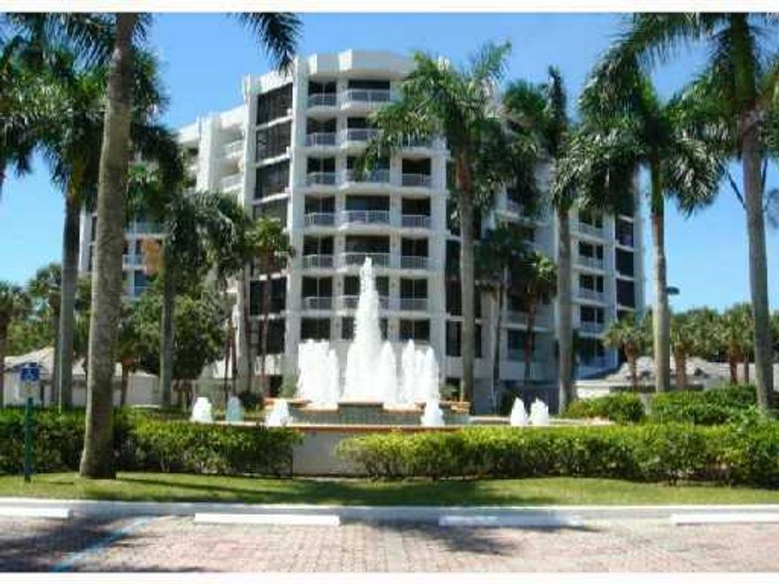 Fairway Point Luxury Midrise apartment. Choice 6th floor location with panoramic S.W. water and golf course view. Third bedroom set up as a den/bedroom with pocket doors to the living room plus custom wall unit with large flat screen TV. Tiled living areas. Both porches glassed in. One is air conditioned and used as an office. All new hurricane windows throughout the entire apartment. Updated kitchen with marble counters and light wood cabinets. Wet bar. Spacious master bedroom with 2 large walk-in closets and Custom wall unit also with a large flat screen TV. Offered unfurnished with furnishings negotiable less art work and personal accessories. Club membership required.