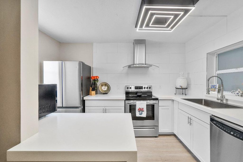 Photo of 2805 SW 22nd Avenue #104, Delray Beach, FL 33445 (MLS # R11152158)