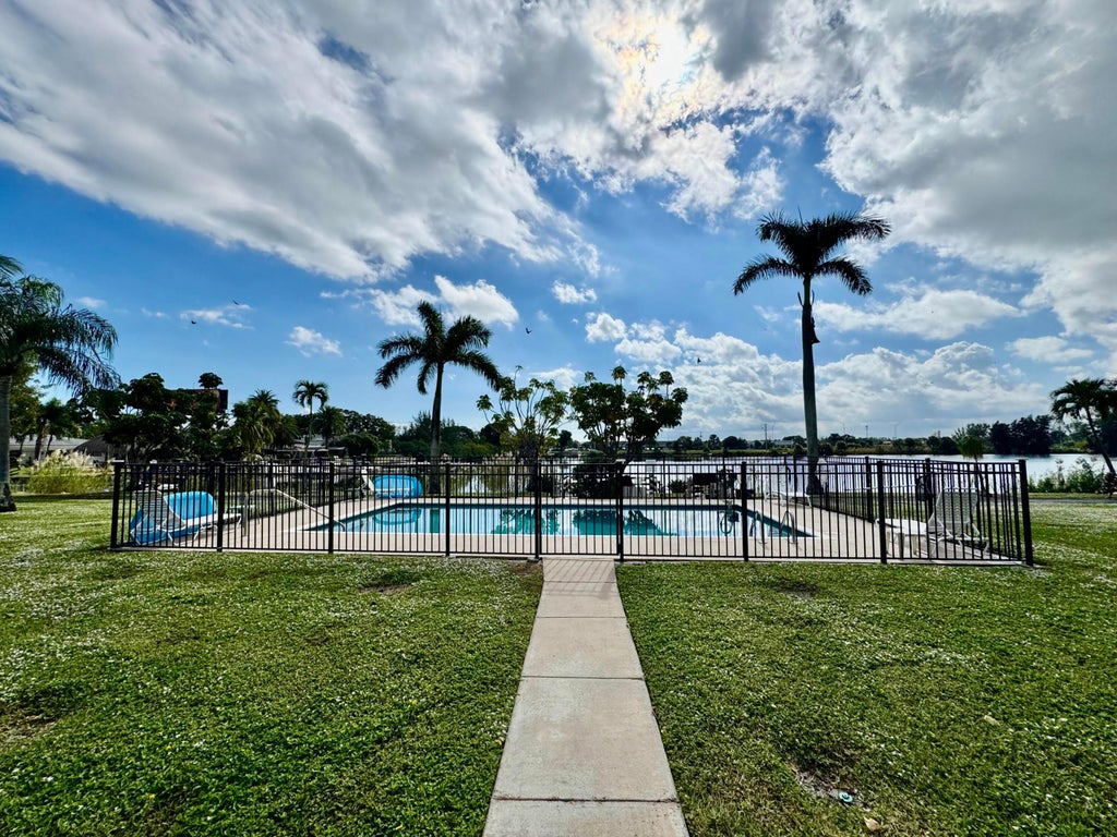 Photo of 960 CRYSTAL LAKE DR #206, Deerfield Beach, FL 33064 (MLS # B26078101)