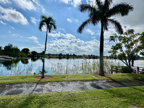 Photo of 960 CRYSTAL LAKE DR #206, Deerfield Beach, FL 33064 (MLS # B26078101)