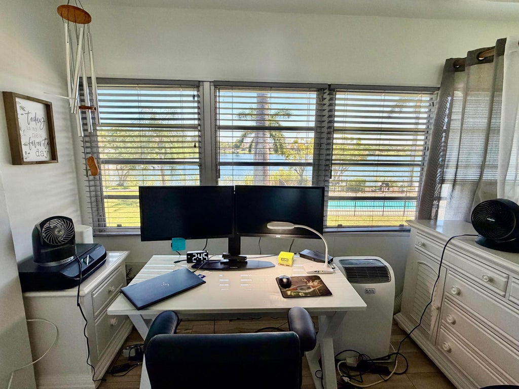 Photo of 960 CRYSTAL LAKE DR #206, Deerfield Beach, FL 33064 (MLS # B26078101)