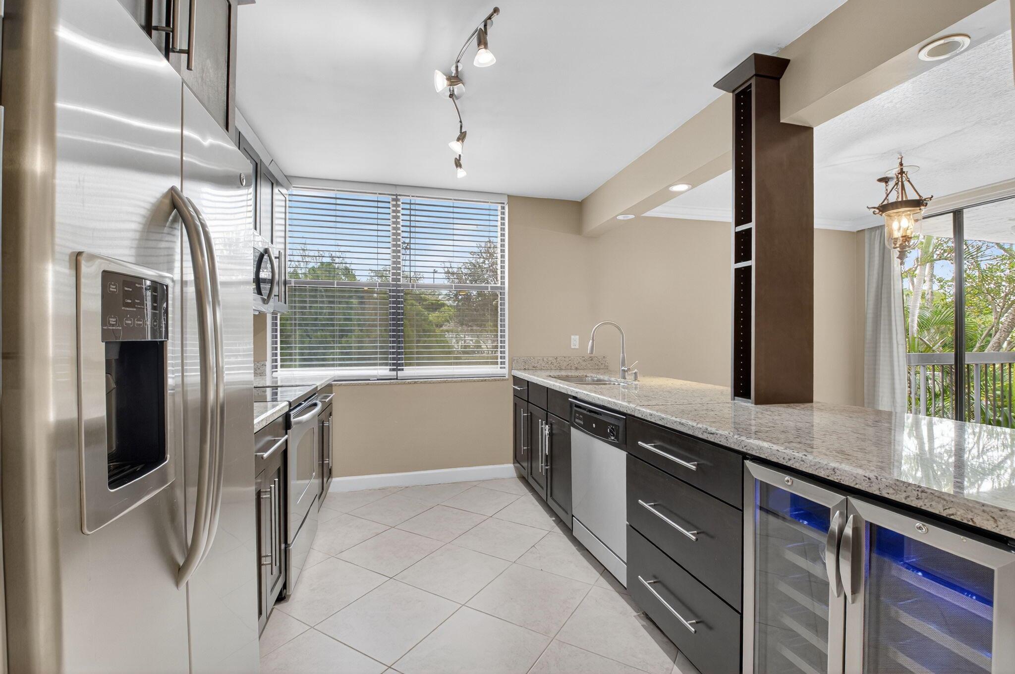 Step into resort-style living with this beautifully updated 1-bedroom, 1-bath condo in the sought-after Delray Racquet Club. Featuring modern finishes, in-unit laundry, and a private balcony, the home offers both comfort and style. Residents enjoy access to multiple pools, tennis and racquetball courts, a fitness center, and scenic walking paths throughout the community. Ideally located just over a mile from the beach and moments from vibrant Atlantic Avenue, you'll also find everyday conveniences like Whole Foods, Publix, Trader Joe's, and Target nearby. The perfect mix of relaxation, recreation, and location awaits in the heart of Delray Beach!