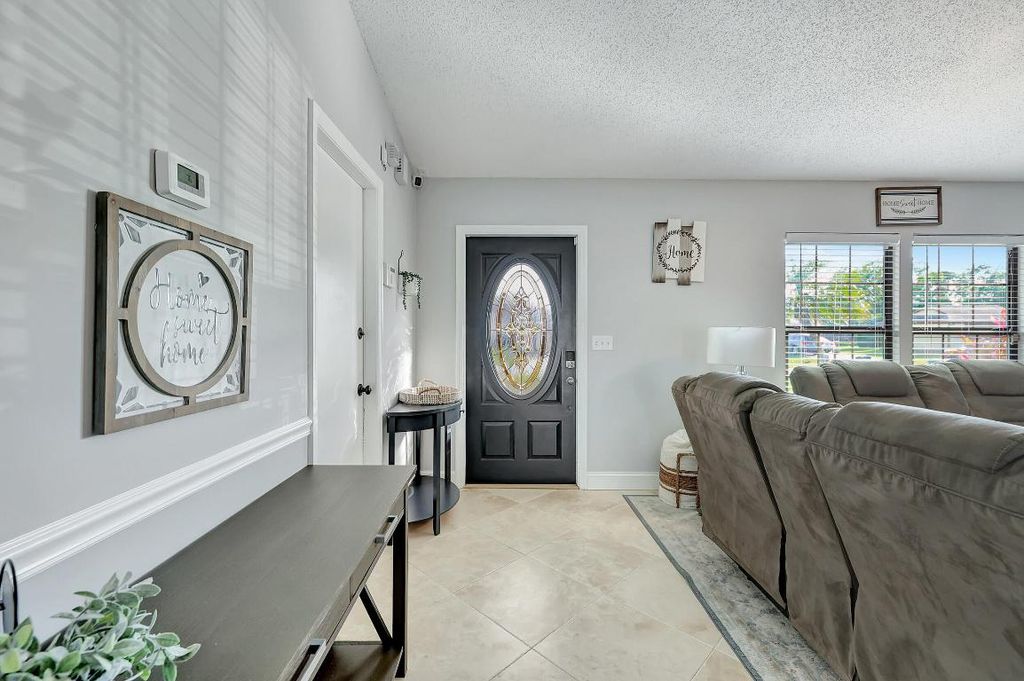 Photo of 279 SW Langfield Avenue, Port Saint Lucie, FL 34984 (MLS # R10968652)