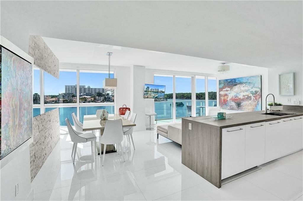 Live the South Florida lifestyle! Stunning water views from each room in this fully furnished turnkey, stylish condo. Open plan kitchen/living area with florida dining room. Beautiful tile flooring, lots of closet space, stylish window coverings, designer furniture and assigned parking spot just steps from your front door! Bright and open throughout the unit with covered and tiled balcony for al fresco dining giving expansive views of the marina & ocean. Enjoy daily sunrise and sunsets! Building has outstanding amenities with 24 hour lobby service. His and hers gyms etc. Assigned parking spot, and valet offered for guests etc. Ideally located close to everything. Steps to the beach, shops/restaurants & short drive to upscale Bal Harbour Shops or Aventura Mall & airports. Seasonal $6400