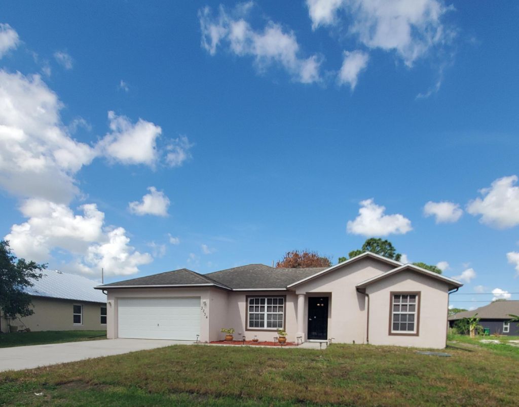 Photo of 3234 SW Fillmore Street, Port Saint Lucie, FL 34953 (MLS # B26017467)