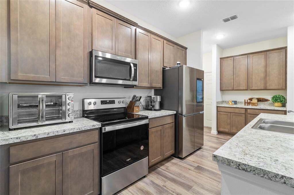 Photo of 714 SW Tupper Lane, Port Saint Lucie, FL 34953 (MLS # R10961356)