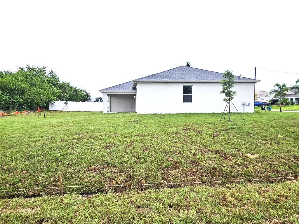Photo of 585 SW Jeanne Avenue, Port Saint Lucie, FL 34953 (MLS # R10996683)