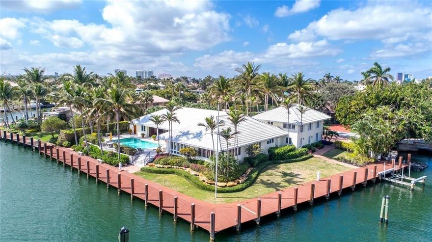 Embrace breathtaking panoramic waterway views from the moment you enter this one-of-a-kind residence. Ideal for boating with 300 ft of waterfront & mins. to the Intracoastal & Atlantic Ocean. This bright open floor plan boasts 10 ft. ceilings, 5BR, 5.5BA, 2-CG. oversized great rm, media rm, dining rm & a lavish master suite. Multiple French drs blend indoor & outdoor living spaces taking advantage of the S. Florida lifestyle. The covered loggia overlooks the pool & daily parade of boats. Sq Ft from BCPA