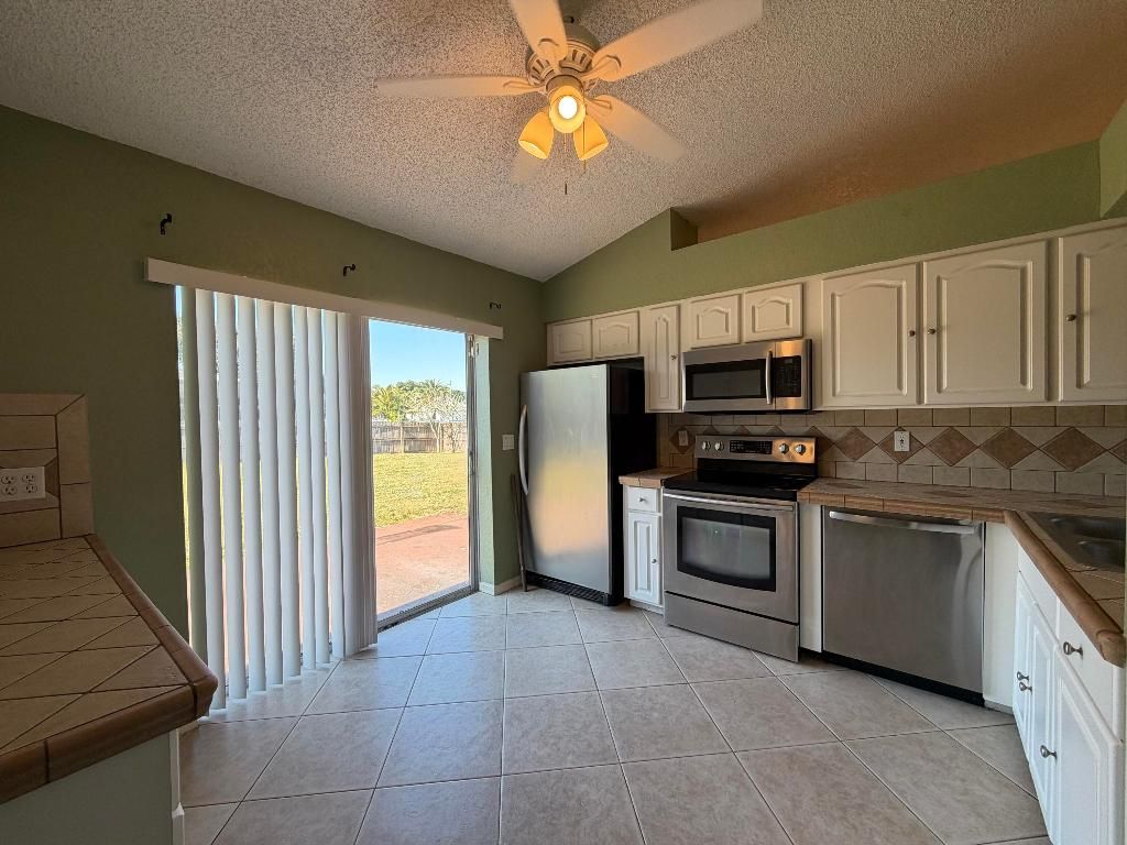 Photo of 3802 SW Kocerik Street, Port Saint Lucie, FL 34953 (MLS # R11150198)