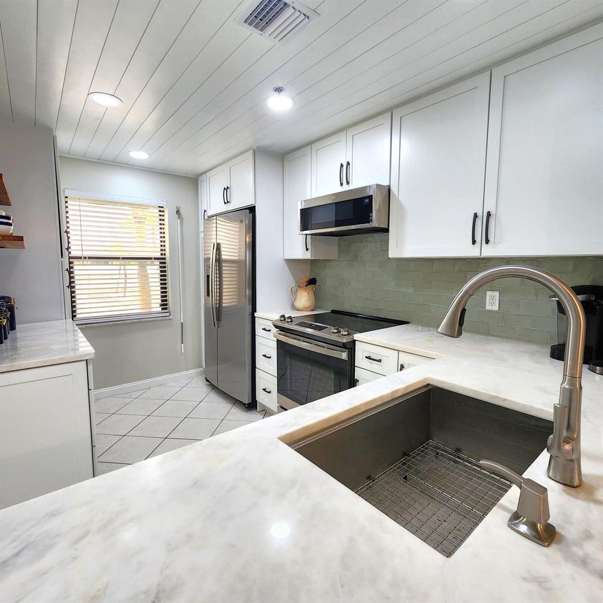Beautifully renovated CORNER unit with distant ocean view and privacy of State Preserve on north side!  Birds, wildlife just outside your balcony and windows!  Furnished and ready to go!  More pictures to come. White cabinetry, granite tops, stainless appliances, baths updated. Secure building with air conditioned lobby!All State Inspections complete, New roof installed, Insurance in place, financially solid community!
