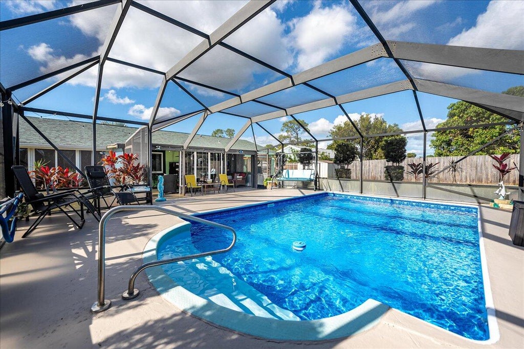 Photo of 1821 SE Manth Lane, Port Saint Lucie, FL 34983 (MLS # R11046399)