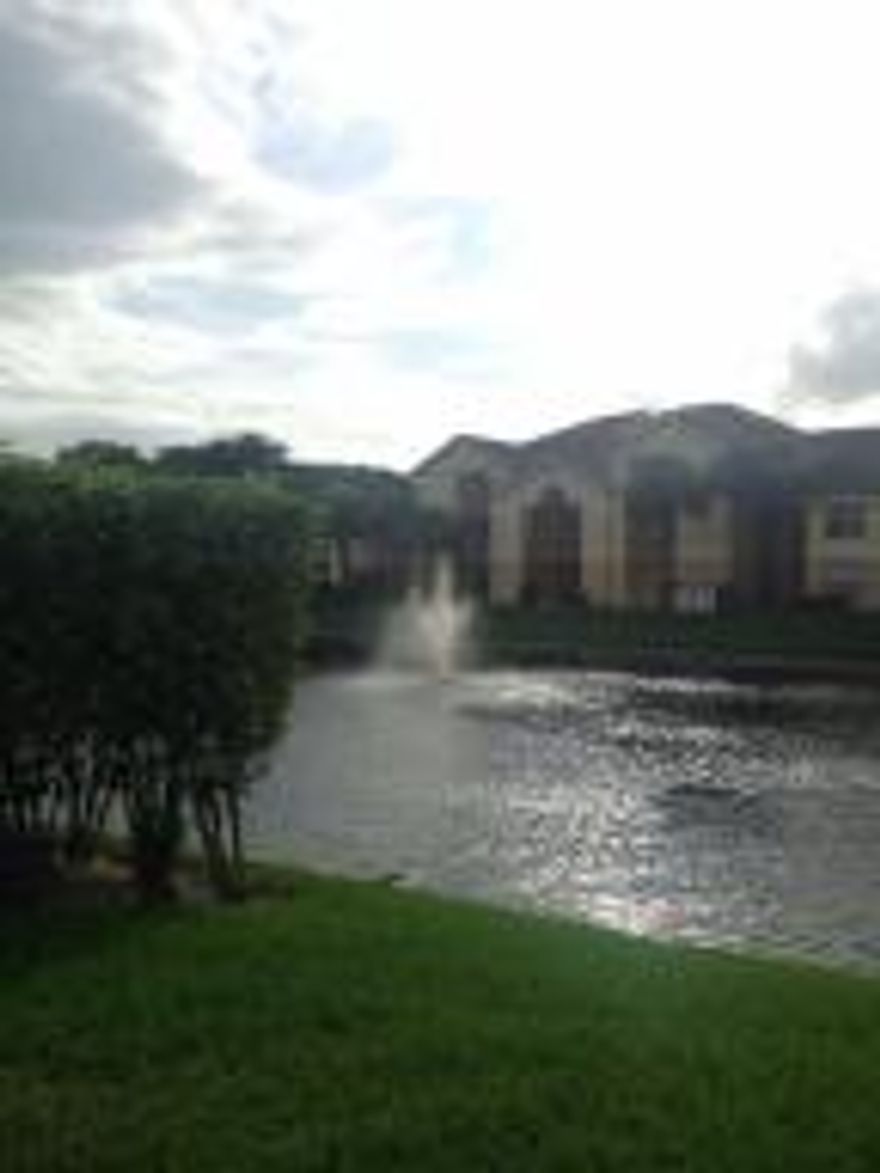 Ready to move-in! Modern 2/2 condo with beautiful tile floors throughout. Master suite with full bathroom and walk-in closet. Full sized washer & dryer in unit. 2 patios and storage area. Great amenities such as clubhouse with pool, fitness center, tennis and more. 2 assigned parking spaces. Easy