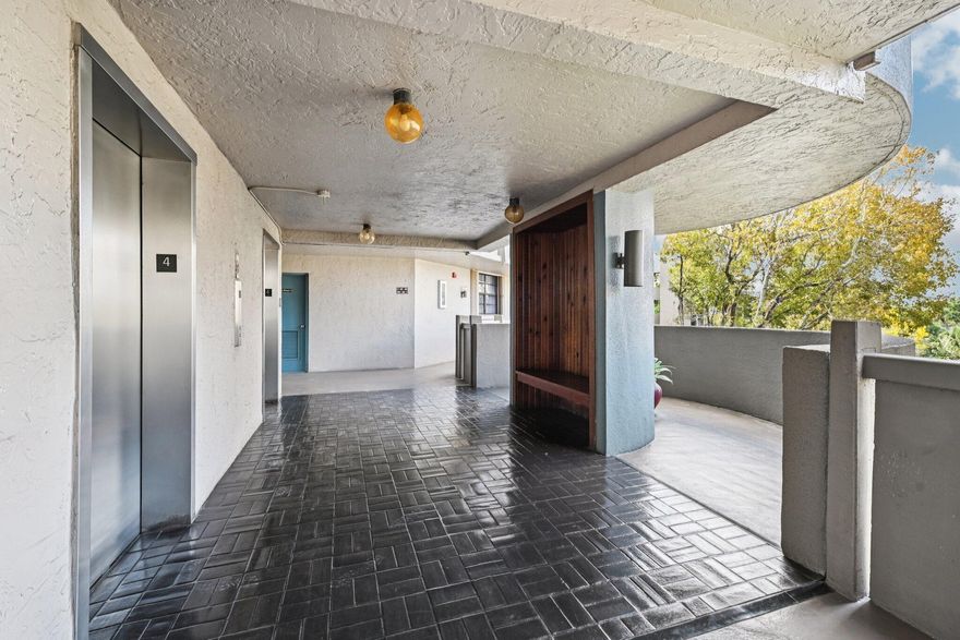 Lovely one bedroom with large den/guest area and two full bathrooms with screened balcony overlooking a beautiful, serene lake.  55+ community with guard gated security.  The kitchen and second bathroom have been upgraded with new cabinets and stainless steel appliances. New carpeting. There is a storage room just around the corner with a large storage area for every unit. Washer and dryer is in the unit. Roll-down shutters on the balcony. There is an elevator in the building. Enjoy resort-style amenities including a clubhouse, heated pool, jacuzzi, tennis, racquetball, billards and a courtesy bus. HOA includes water, cable, internet, building maintenance, roof, common area and all amenities. No pets or leasing is allowed. MOTIVATED SELLER - schedule your showing via ShowingTime. PARKING SPACE NUMBER IS #41